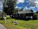 Quaint single Gathering home with front porch, mailbox, and lush green lawn at 914 2Nd St, Orlando, FL 32824