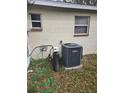 View of the side of the house featuring the AC unit, water softener, and electrical components at 1130 E Bay St, Winter Garden, FL 34787