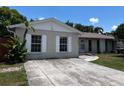 Charming single-story home featuring a spacious driveway and well-maintained front yard at 131 San Blas Ave, Kissimmee, FL 34743