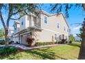 Two-story home featuring a manicured lawn and a paver walkway leading to the entrance at 1335 E 10Th St, Apopka, FL 32703