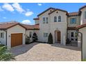 Beautiful home featuring a brick driveway, a charming arched doorway, and a private gate at 15644 Panther Lake Dr, Winter Garden, FL 34787