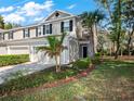 Inviting home exterior featuring a well-manicured lawn and tasteful landscaping at 2056 Switch Grass Cir, Ocoee, FL 34761