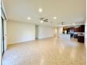 Bright and airy living room showcasing an open floor plan to the kitchen at 2706 Vermillion Ct, St Cloud, FL 34771