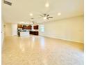 Spacious living room featuring tile flooring and an open layout to kitchen at 2706 Vermillion Ct, St Cloud, FL 34771