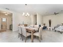 Dining room featuring a dining table set, tile flooring and an open concept design at 2929 Satire St, Kissimmee, FL 34746