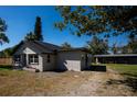 A bright, airy home with a new roof and attractive, neutral paint scheme surrounded by mature trees at 4452 Fairview Ave, Orlando, FL 32804