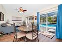 Cozy dining area with a view of the pool through sliding glass doors at 4826 S Saint Brides Cir, Orlando, FL 32812