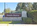 Community sign made of stone with manicured landscaping. Hamlin Reserve at 15471 Honeybell Dr, Winter Garden, FL 34787