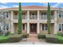 Detailed view of the home's entry showing a brick walkway and stately architectural features at 3414 Cocard Ct, Windermere, FL 34786