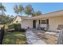 Inviting front porch with seating area and decorative touches at 3430 Laurel Dr, Mount Dora, FL 32757