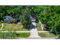 Aerial view of the house showing the property's layout and the surrounding lush greenery and landscaping at 418 S Summerlin Ave, Sanford, FL 32771
