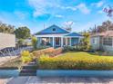 Inviting home with colorful shrubs and lovely lawn, enhancing its curb appeal and highlighting a welcoming front porch at 434 E Harding St, Orlando, FL 32806