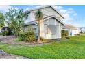 Well-maintained home surrounded by lush landscaping and beautiful trees at 53 Fore Dr, New Smyrna Beach, FL 32168