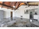 Bright, airy living area with wood-beam ceiling and marbled tile floors, connecting seamlessly with the kitchen at 812 2Nd St, Altamonte Springs, FL 32701