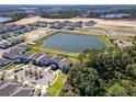 Expansive aerial view of a modern community with new construction, lakes, parks and walking trails at 11206 Pixie Mandarin Ct, Winter Garden, FL 34787
