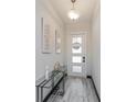 The entryway is designed with modern decor and a glass console table at 15724 Cutter Sail Pl, Winter Garden, FL 34787