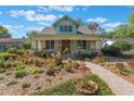 Inviting two-story home with a lush front yard and charming craftsman details at 1612 E Washington St, Orlando, FL 32803
