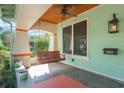 Inviting covered front porch with a swing and classic craftsman details at 1612 E Washington St, Orlando, FL 32803