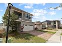 Attractive two-story home with a modern design, two-car garage, and a brick driveway at 2546 Empress Dr, Kissimmee, FL 34741
