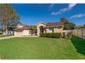 Well maintained single Gathering home featuring a large front yard, spacious driveway, and attached two car garage at 2901 Eagle Lake Dr, Orlando, FL 32837