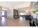 Open-concept living room with vaulted ceilings, neutral paint, and sliding glass doors to the patio at 2901 Eagle Lake Dr, Orlando, FL 32837