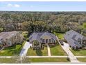 Expansive aerial view showcasing the home, lush landscaping, and surrounding neighborhood at 358 Woldunn Cir, Lake Mary, FL 32746