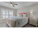 Bright bedroom featuring a queen bed with a starfish theme and a window with shutter blinds at 3801 S Atlantic Ave # 105, New Smyrna Beach, FL 32169