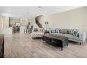 Open-concept living area flows into the kitchen with wood-look tile flooring at 3908 Grassland Dr, Orlando, FL 32824