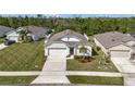 Well maintained single-Gathering home with two car garage and landscaped front yard with St. Augustine grass at 512 Stowers Dr, New Smyrna Beach, FL 32168