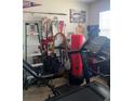 Bedroom containing home gym equipment. Cluttered and not optimized at 8124 Claire Ann Dr # 303, Orlando, FL 32825