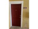 Exterior door with number plaque indicating the unit is 303 at 8124 Claire Ann Dr # 303, Orlando, FL 32825