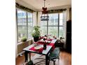 Elegant dining room with large windows, modern lighting, and hardwood floors at 860 N Orange Ave # 318, Orlando, FL 32801