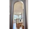 Bright kitchen view through a stylish arched entryway, open layout at 860 N Orange Ave # 318, Orlando, FL 32801