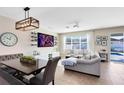 Comfortable living room with a view of the pool, plus a dining table at 8743 Sidley Ln, Orlando, FL 32832