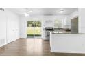 Open kitchen featuring stainless steel appliances, granite countertops, and easy access to the backyard at 925 Valleydale Ave, Deland, FL 32720