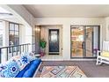 Spacious patio with cozy seating, views into the kitchen, and a door to the front entrance at 1055 Kensington Park Dr # 609, Altamonte Springs, FL 32714