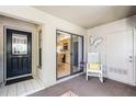 Enclosed patio with tile floors, a rocking chair, and a view into the kitchen through sliding doors at 1055 Kensington Park Dr # 609, Altamonte Springs, FL 32714