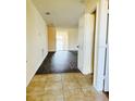 Welcoming entryway features neutral tile floors and opens to spacious living area at 15090 Waterford Chase Pkwy, Orlando, FL 32828
