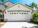Close up of garage door on single-story home featuring a two-car garage at 2112 White Eagle St, Clermont, FL 34714