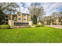 Elegant community entrance with manicured lawn and signage for The Madison at MetroWest at 2624 Robert Trent Jones Dr # 633, Orlando, FL 32835