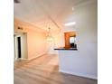 Inviting dining area with light hardwood floors and modern pendant lighting fixture at 2624 Robert Trent Jones Dr # 633, Orlando, FL 32835