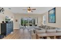 Relaxing living area with sliding glass doors opening to the outdoor patio at 4009 Swan Goose Ct, Okahumpka, FL 34762