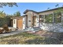 Charming single-story home with an inviting front entrance with upgraded features at 4249 Kendrick Rd, Orlando, FL 32804