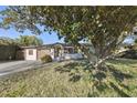 Charming single-story home with a well-maintained front yard, mature tree and inviting curb appeal at 4249 Kendrick Rd, Orlando, FL 32804