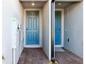 Private entryway featuring brick ground cover and modern door finishes at 4332 Ranch House Rd, St Cloud, FL 34772