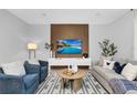 Beautiful living room with modern decor and a stylish accent wall at 730 Longboat Dr, Davenport, FL 33896