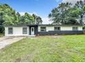 Inviting single-story home with manicured lawn, updated paint, and classic curb appeal at 758 Osceola Dr, Sanford, FL 32773