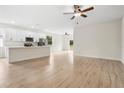 Bright, open-concept living area featuring hardwood floors and abundant natural light at 833 S Hancock Dr, Deltona, FL 32725