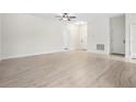 Well-lit living room featuring hardwood floors and neutral colors at 833 S Hancock Dr, Deltona, FL 32725