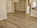 Spacious living area showcasing durable wood-look floors and easy access to kitchen area at 860 N Orange Ave # 444, Orlando, FL 32801
